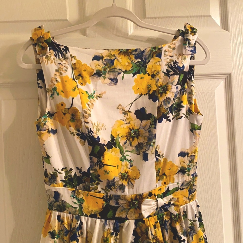 Unique Vintage’s Iconic blue & yellow floral swing dress